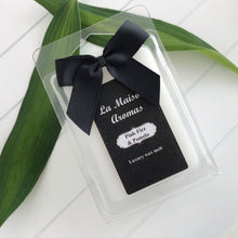 Load image into Gallery viewer, Made with love, our cruelty-free, vegan wax is hand-poured to create smooth and creamy melts that are both highly scented and long-lasting.  Our six-piece clamshell melts are available in our full range of fragrances, packaged in recycled materials and dressed in an elegant black bow. 
