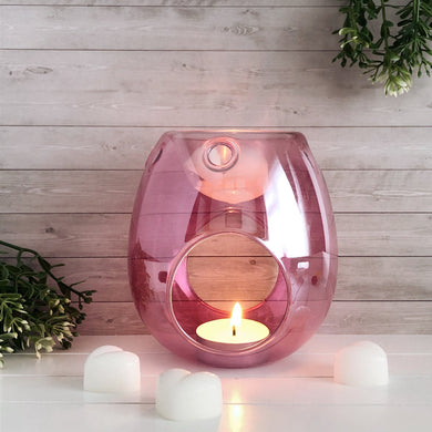 This elegant wax melt burner is the perfect addition to any modern home. Made from glass, each piece is handblown and designed to release fragrance throughout your home at the ideal temperature to produce the optimum scent throw.